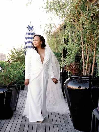Bride standing in garden area at wedding hotel