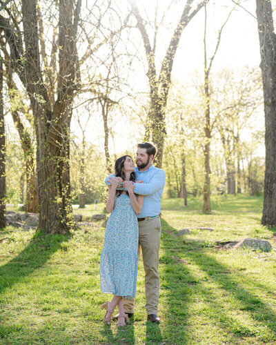 Couple embracing by wedding photographers lexington ky