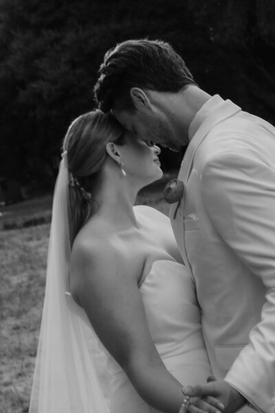 Wedding Photography, black and white image of couple about to kiss