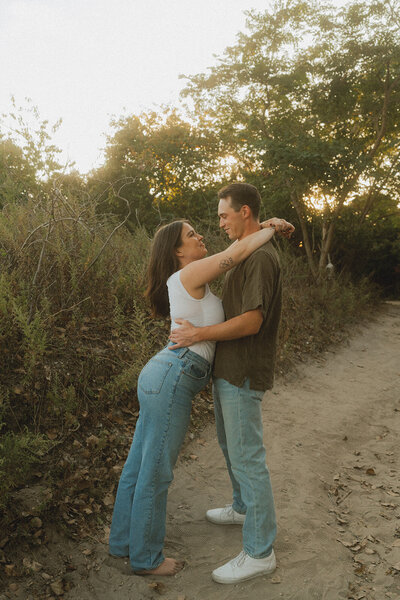 engaged couple pose on the jersey shore for their philadelphia engagement session