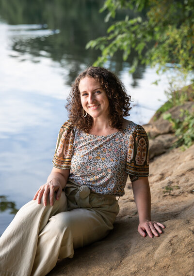 A tA female poses by Loch Raven Park during her personal branding session in Baltimore County, Maryland