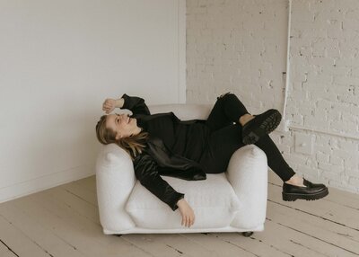 Renee Hoffman laying back on couch
