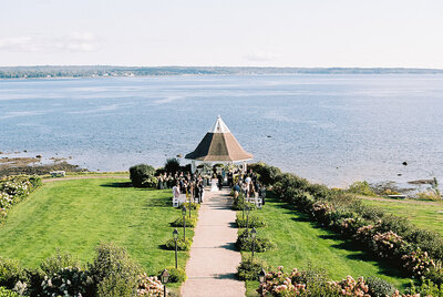 A waterfront wedding ceremony under the gazebo at French’s Point, with panoramic ocean views and timeless coastal charm — photographed by Asia Pimentel.