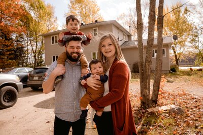 A young family poses for picture