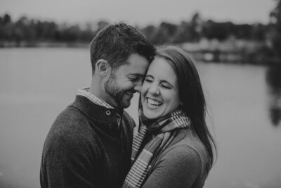 Woman smiling as groom smiles down at her