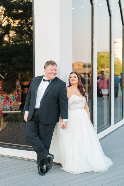 Kentucky couple stands in front of the venue on their wedding day