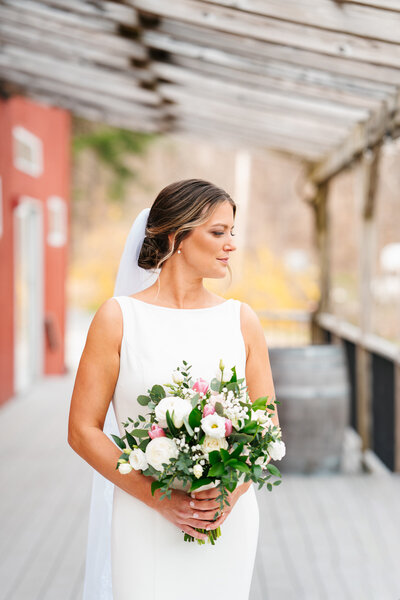 April wedding in New England with early spring blossoms and soft natural light.