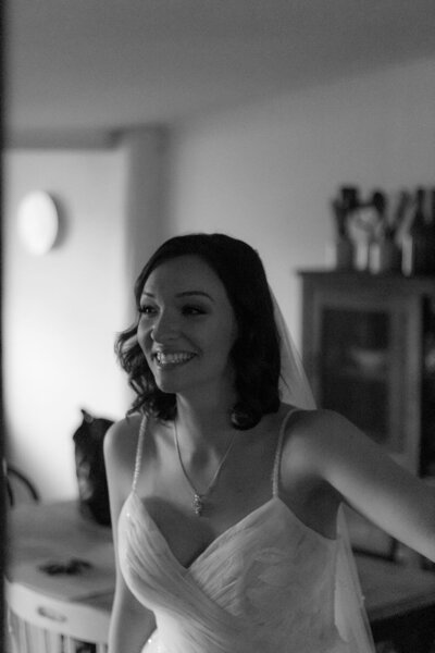 Bride smiling and not looking at camera-black and white image