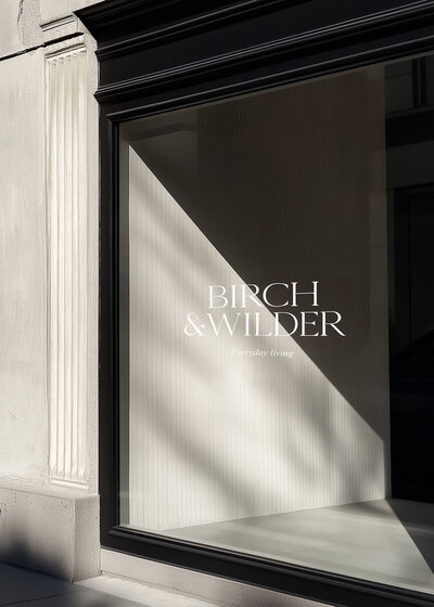 Minimalist storefront mockup for home and lifestyle brand “Birch & Wilder,” featuring elegant logo design and refined typography—an example of strategic brand design and creative direction in retail.