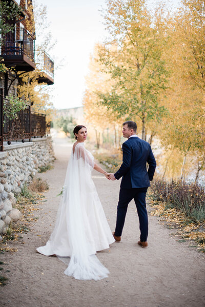 Couple enjoys a moment outside during their summer wedding in Aspen.