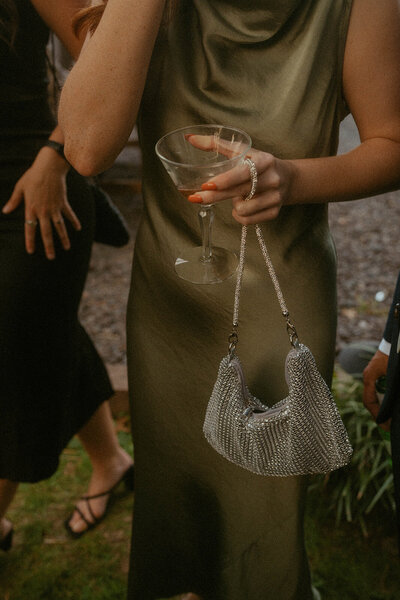 Fashion-forward wedding guest with cocktail and glam accessories, Pennsylvania wedding