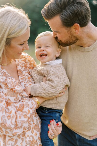 Mom and dad holding toddler family session