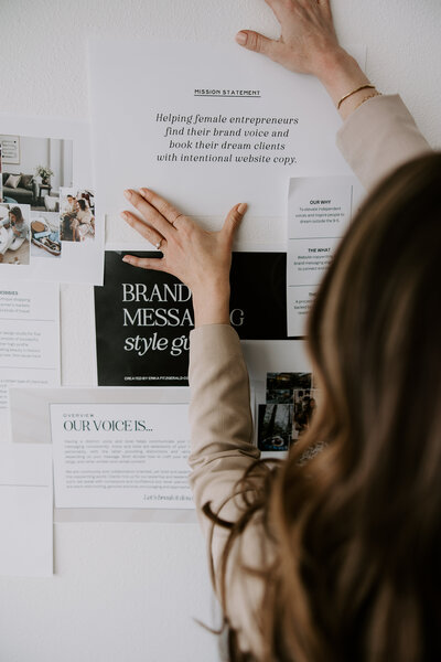 A website copywriter looking at a brand messaging guide