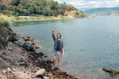 Standing on the rocky beaches of Lake Atitlan Guatemala