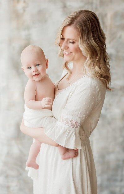 mom holding her son in San Francisco photography studio