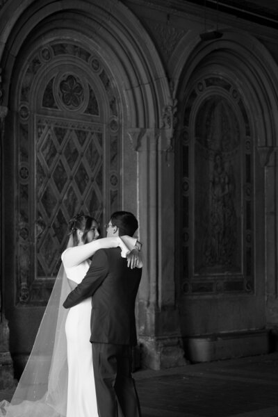 bride and groom dancing in central park