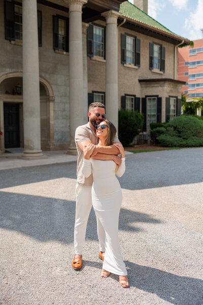 Groom holding brid