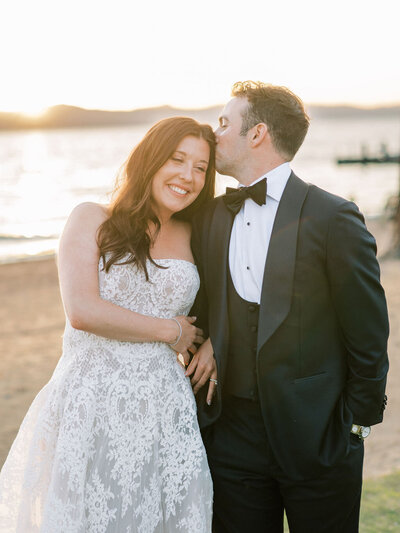 Bride and Groom getting close at sunset lakeside in Lake Tahoe, California