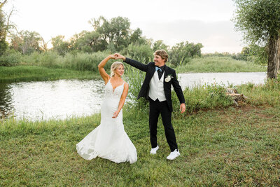 wedding couple dancing by the river at Elk Hollow venue