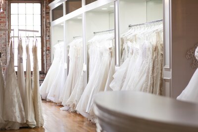bridal boutique with gown bays full of couture gowns