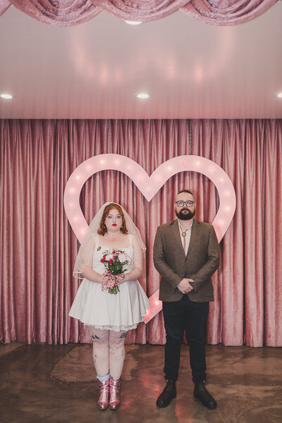 bride and groom pose after las vegas elopement