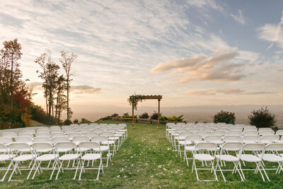 The grassy area outside the barn at Hidden Hill wedding and event venue set up for a large wedding.