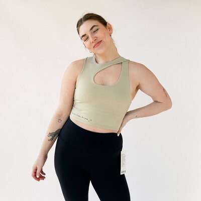 woman wearing oat asymmetrical workout top