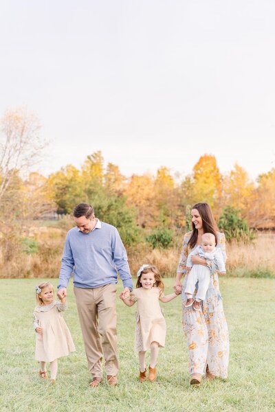 family of 5 walking during their fall minis in Sterling, Virginia