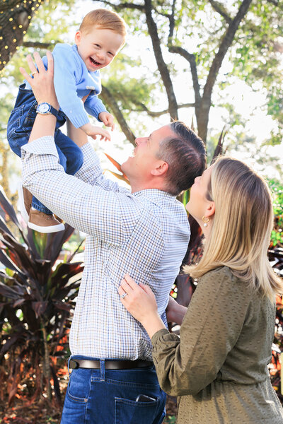 Florida bride holds her cathedral veil before her private estate wedding ceremony
