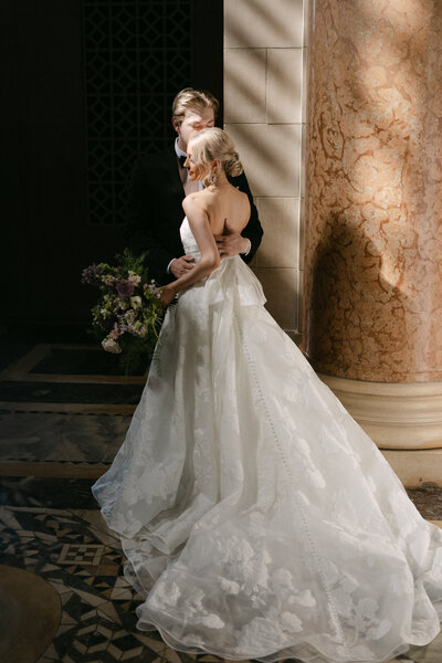 classy bride and groom in nebraska state capitol