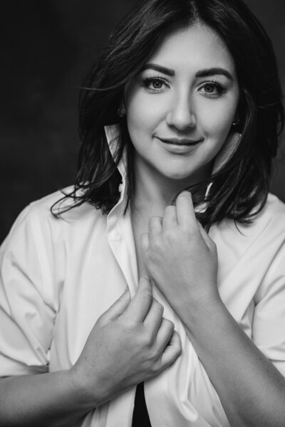 Alex Blair sitting in a chair wearing a colorful outfit