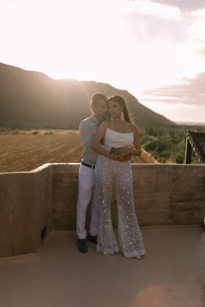 Couple at the entrance of luxury hotel Paradero in Todos Santos, Mexico during their elopement.