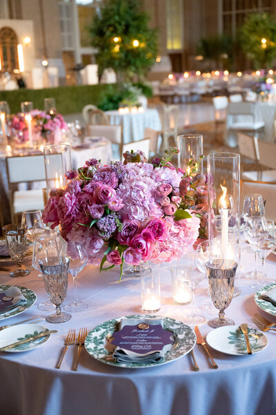 Wedding reception with the couple at a large head table, kissing