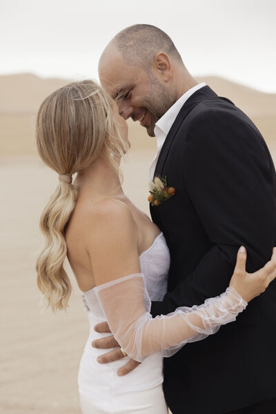 couple getting married in the dunes