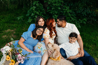 Newborn baby wrapped in blue for his photo session
