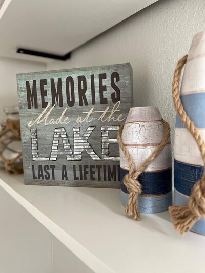 wood sign that says memories made at the lake last a lifetime