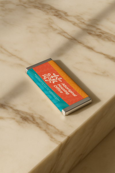 Luxury personalised chocolate bar with Aboriginal Housing Office custom design, created by Barilliant for premium corporate gifting.