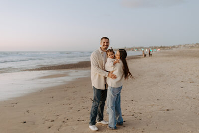 Beach candid natural fun family photo shoot with kids, christmas holiday card photo shoot, San Diego portraits photographer, young families