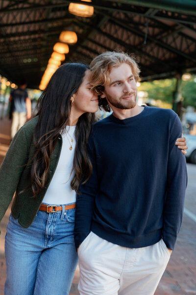 A couple standing close about to kiss