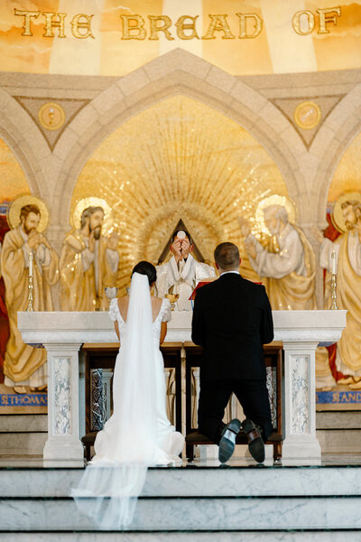 Bride and groom smiling at each other