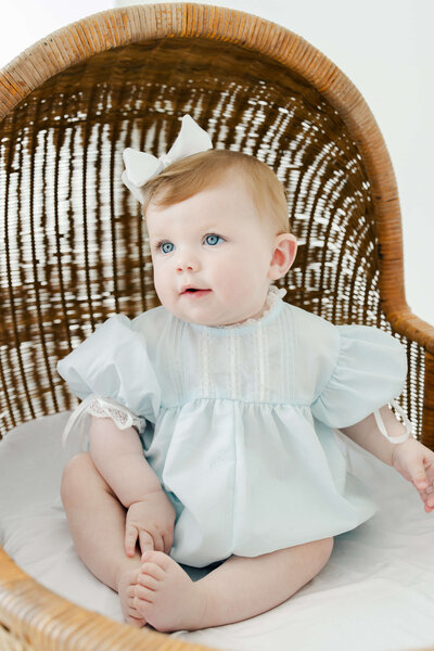 Baby standing on a chair during photography session in dothan alabama