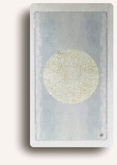 Minimalist tarot card featuring a textured white circle on a light background, symbolizing the full moon.