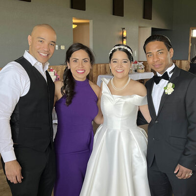 minneapolis wedding videographer, ariel, takes phone call on a table