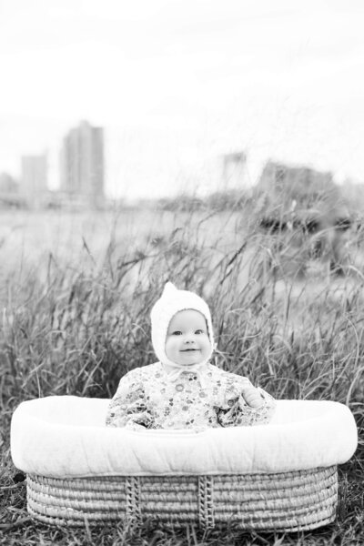 Expecting mother embraces partner for maternity photo session in Minnesota