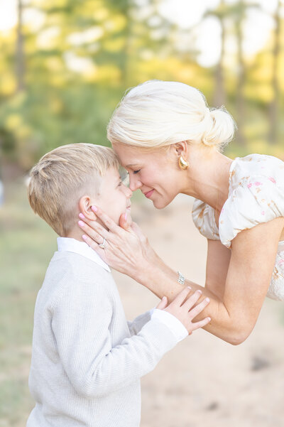 family smiling at each other taken by family photographers in raleigh nc	