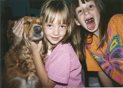 Two little girls with their dog