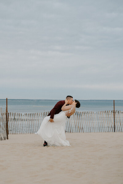 groom dipping bride