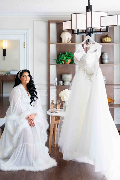 Bride looking at her wedding dress