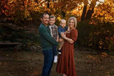 beautiful family in the fall at a park