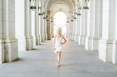 Law grad poses outside Union Station during graduation session photographed by Baltimore Graduation Photographer